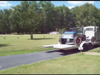 vintage tow truck with an unusual load